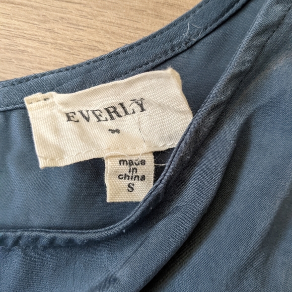 Asymmetrical, teal dress with waist cinching. - Picture 3 of 7